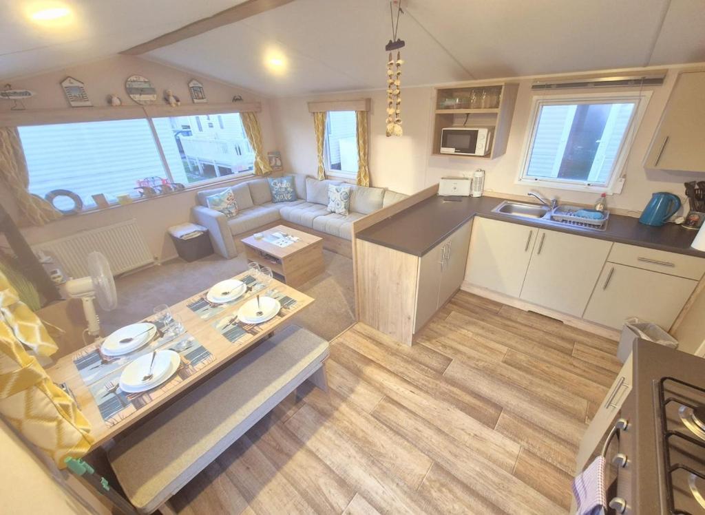 an aerial view of a living room and kitchen in a caravan at Whitstable Hollington in Seasalter