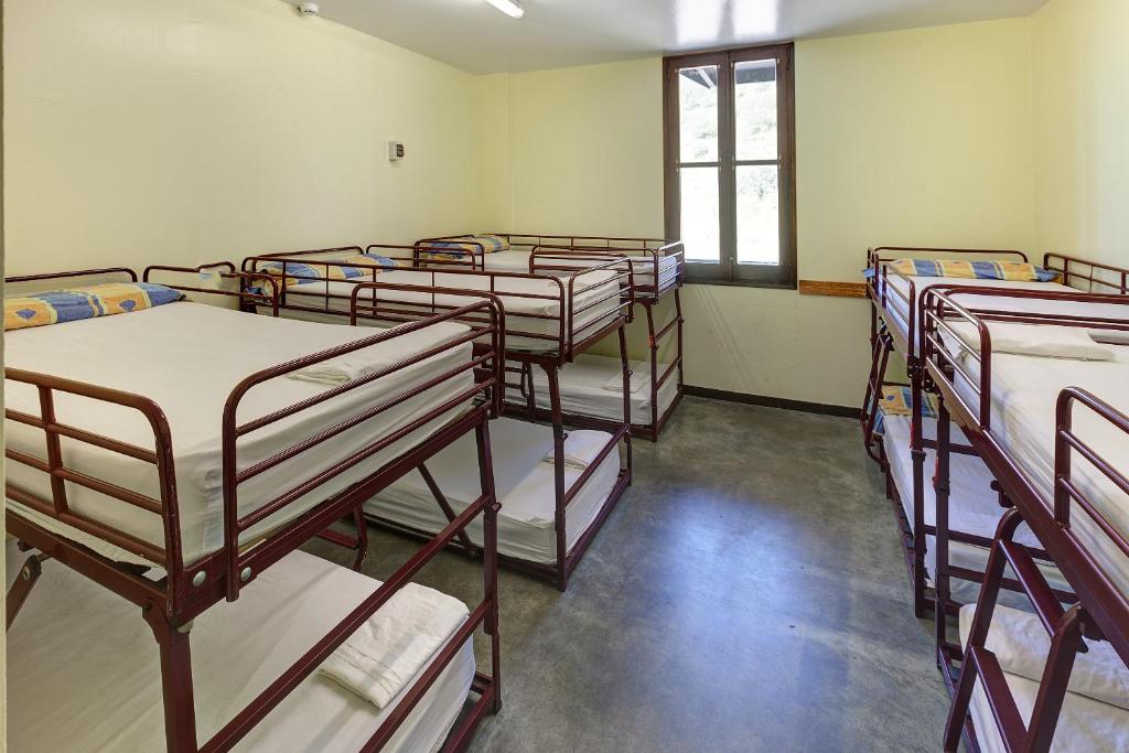 Postel nebo postele na pokoji v ubytování Alberg Les Estades