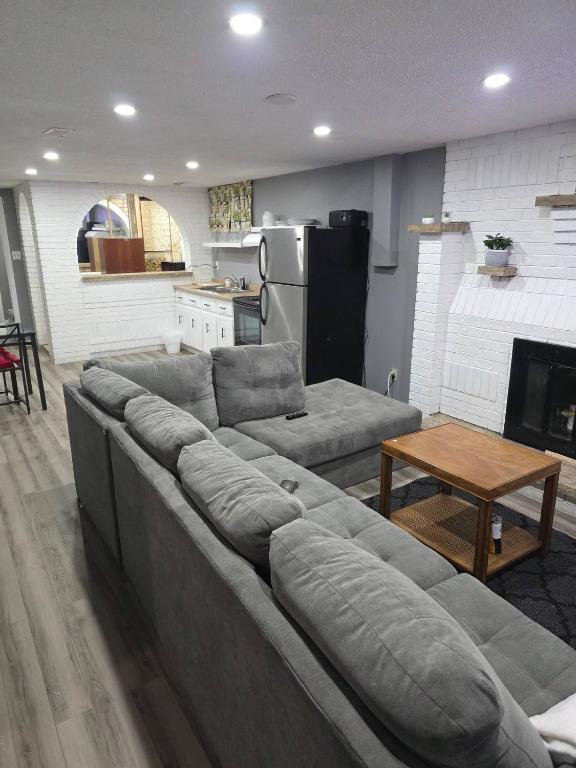 a living room with a couch and a table at Bright Cozy 2-Bedroom Main Floor Suite in Brampton