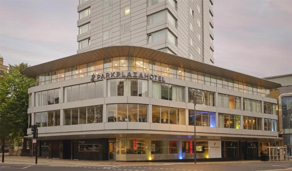 a large building with a sign on the front of it at Park Plaza Leeds in Leeds