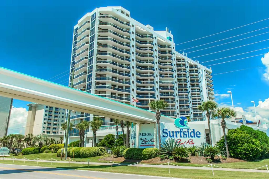 a large building with a surfside sign in front of it at Charming condo with shared pool Gym and Tennis in Destin