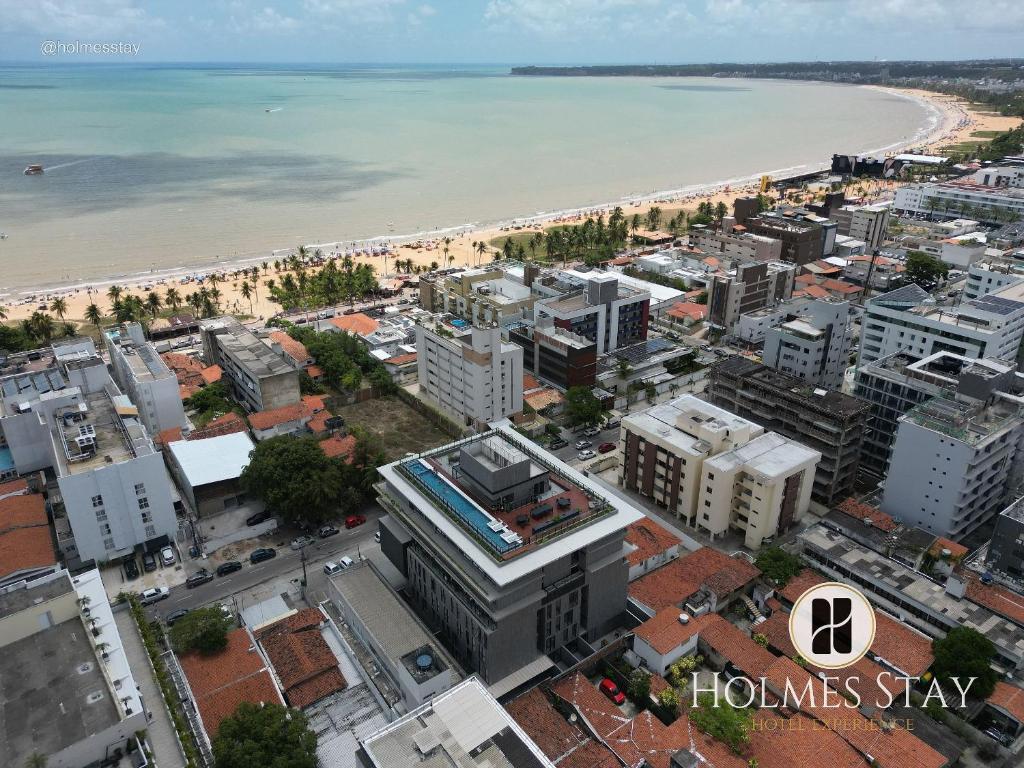 an aerial view of a city and the beach at Acqua Tambaú Luxury Flat 100 meters from the sea in João Pessoa