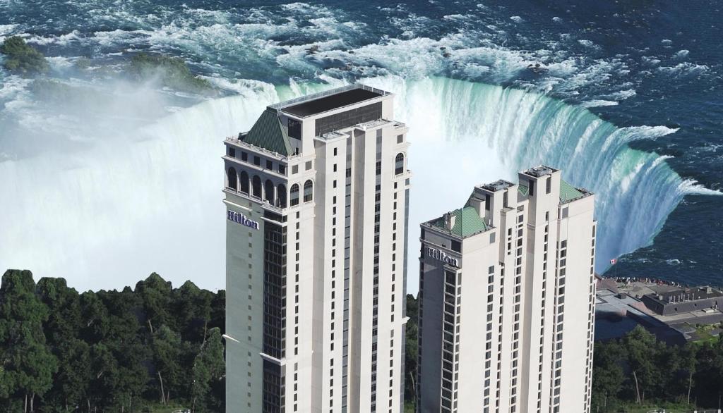 a rendering of niagara falls with two tall buildings at Hilton Niagara Falls/ Fallsview Hotel and Suites in Niagara Falls