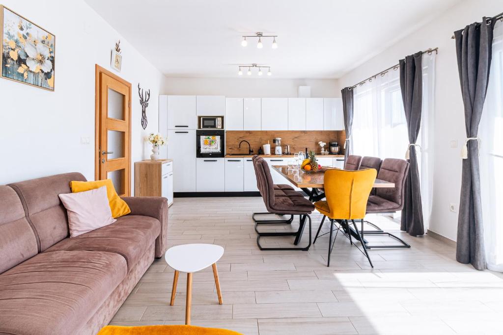 a living room with a couch and a table at Apartment Petar in Kaštela