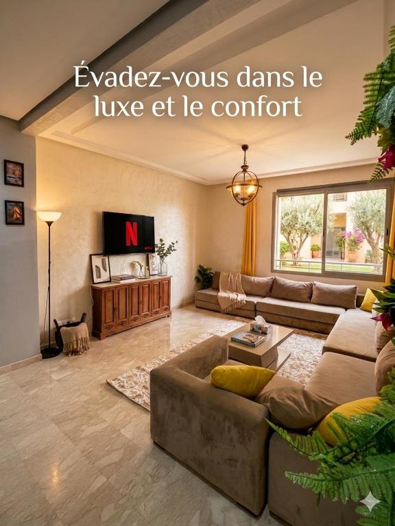 a living room with a couch and a table at Airport Luxury Residence Taj collection 1 in Casablanca