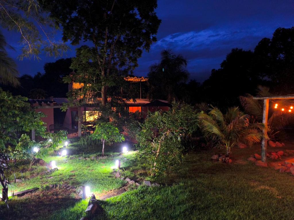 a garden at night with lights in the grass at Camisão CasaJuMa Pixixi in Aquidauana