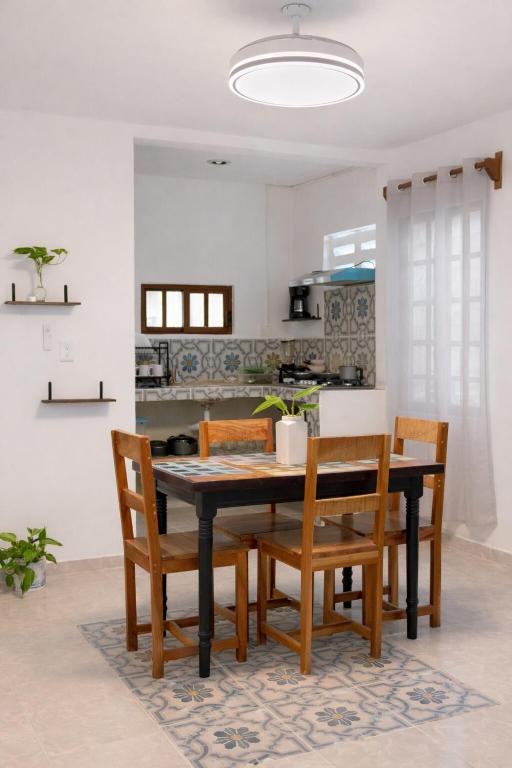 a dining room with a table and chairs at Paradise Renewed Beach House for Deep Relaxation in El Cuyo