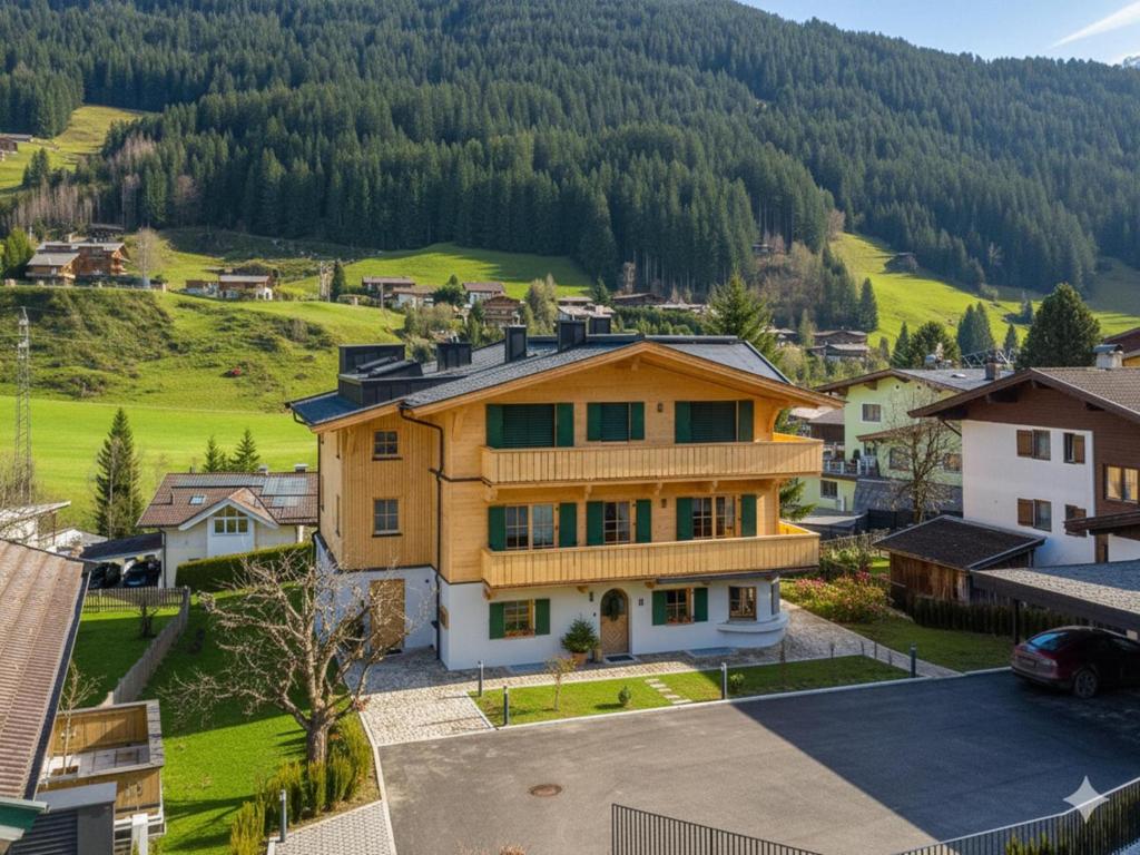 an aerial view of a house in a village at Haus Tauernblick Top 4 in Jochberg