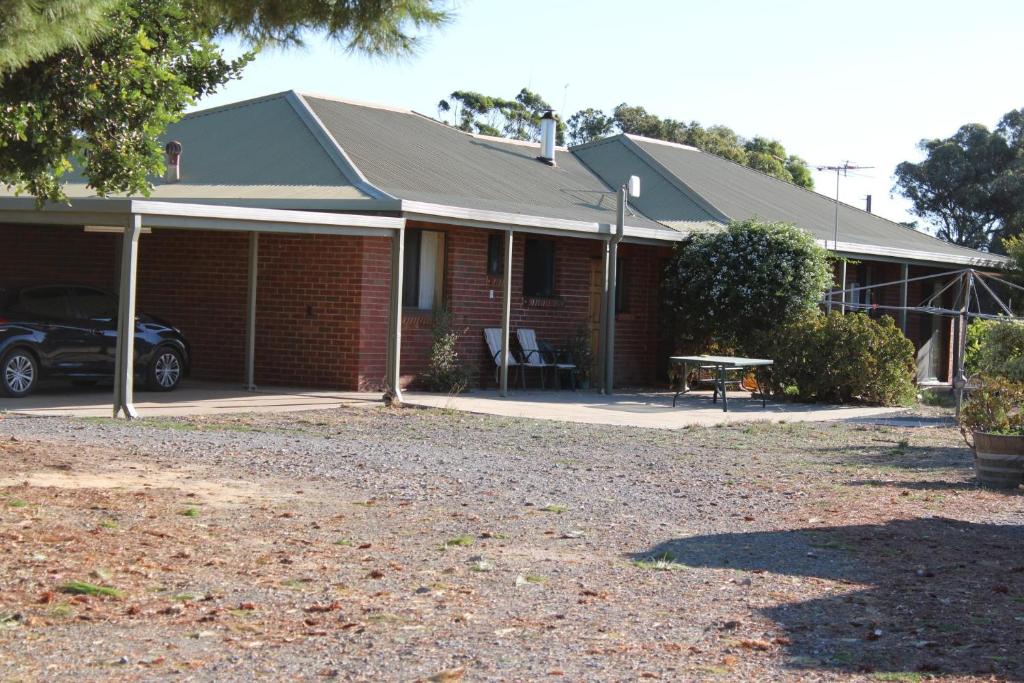 a house with a car parked in front of it at Willunga Farm Retreat in Willunga