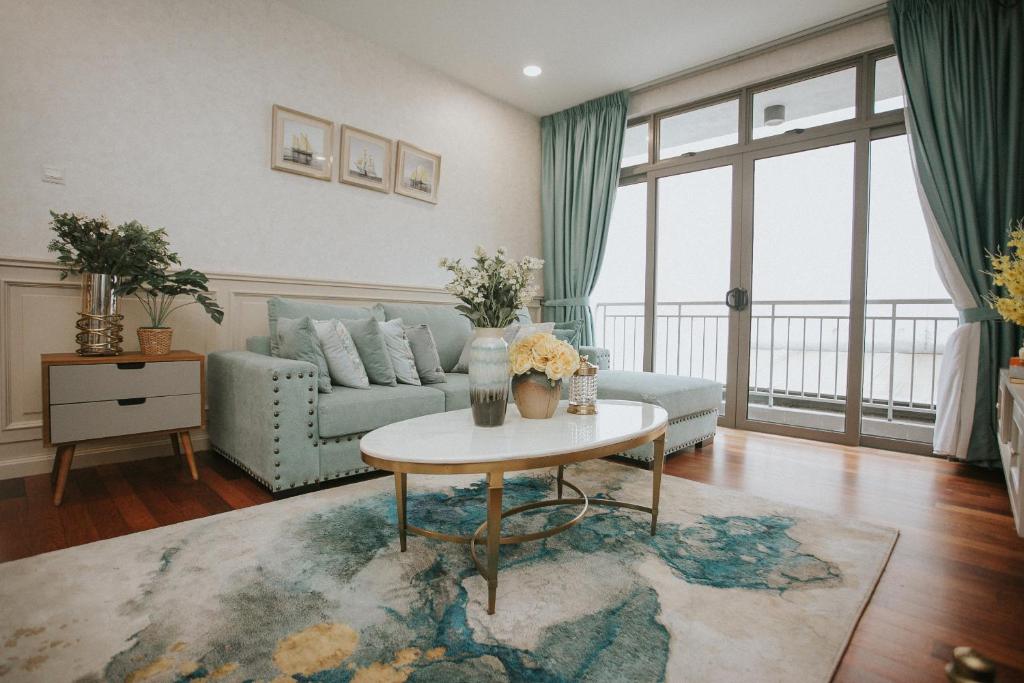 a living room with a couch and a table at Pearly 16 in Putrajaya