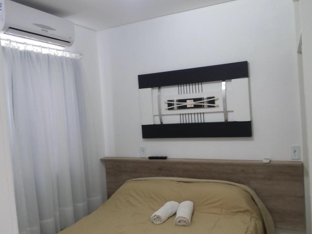 Postel nebo postele na pokoji v ubytování Residencial Neto