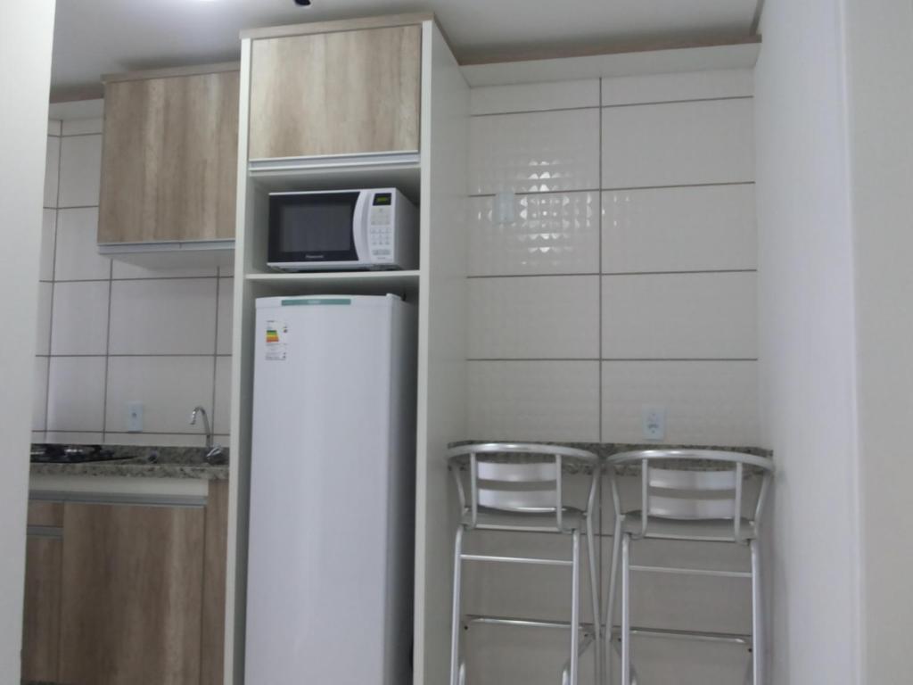 Kuchyň nebo kuchyňský kout v ubytování Residencial Neto