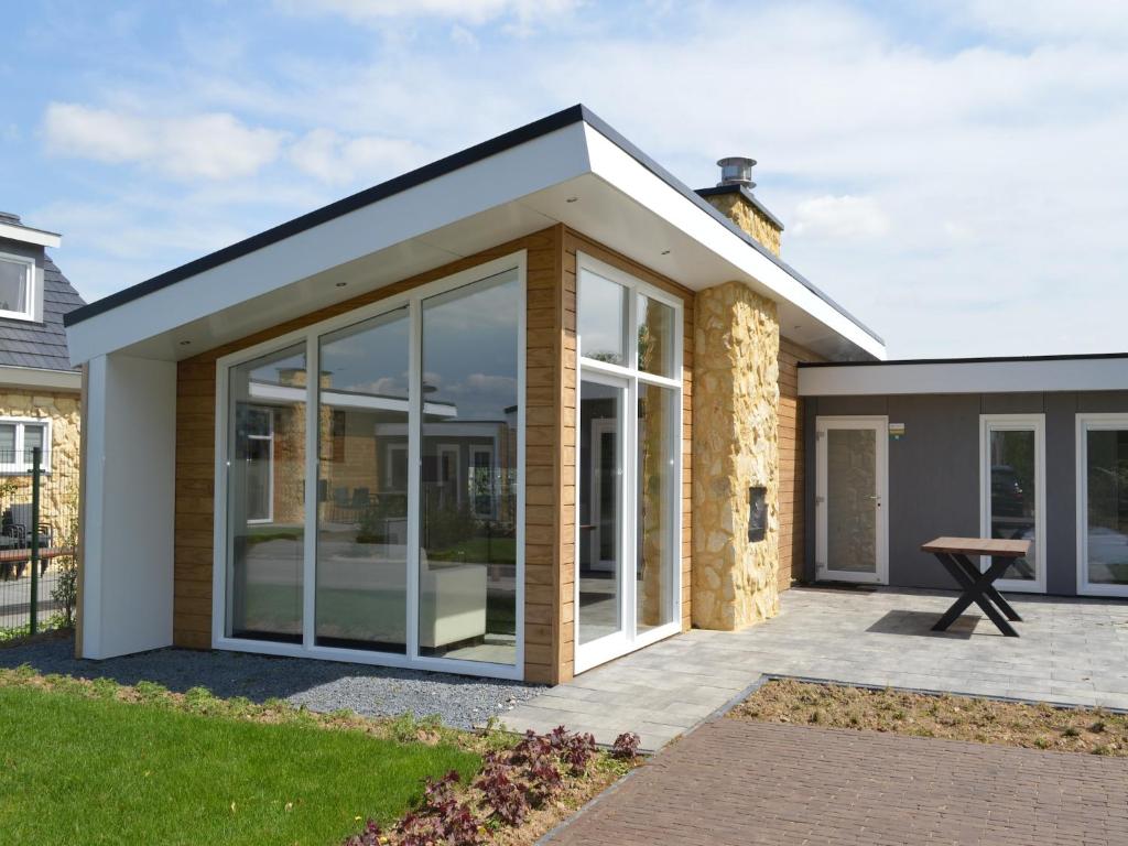 an extension to a house with large sliding glass doors at Bemelen Holiday Home for 6 in Bemelen