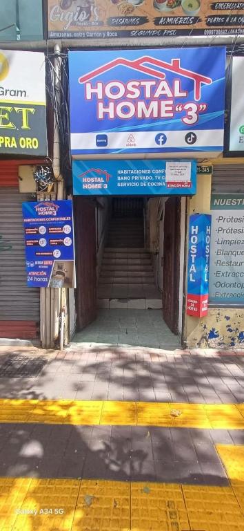 a building with a hospital home sign in front of it at Hostal home 3 in Quito