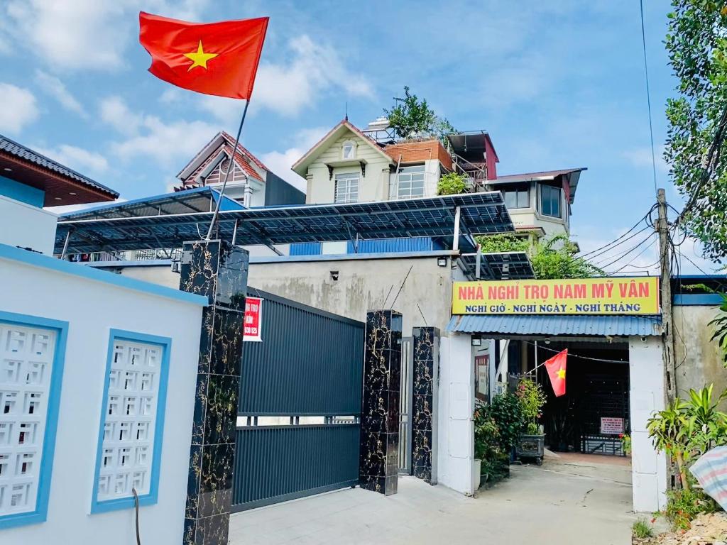 a chinese flag on top of a house at Nam My Van Homestay - Thai Nguyen in Thái Nguyên