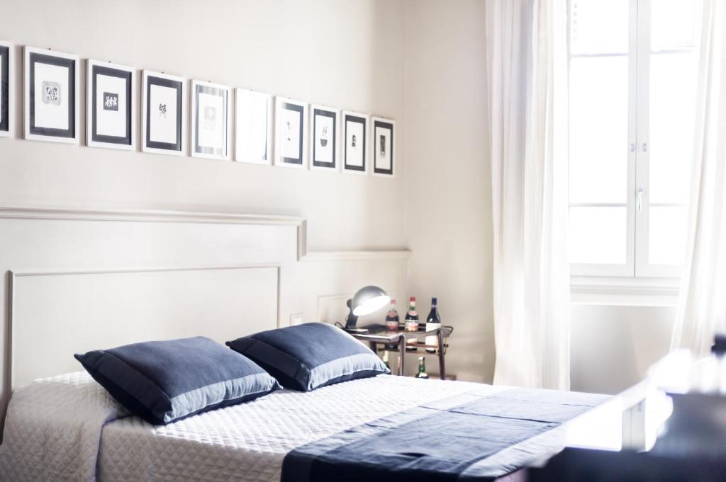 Letto o letti in una camera di Arnobio Florence Suites