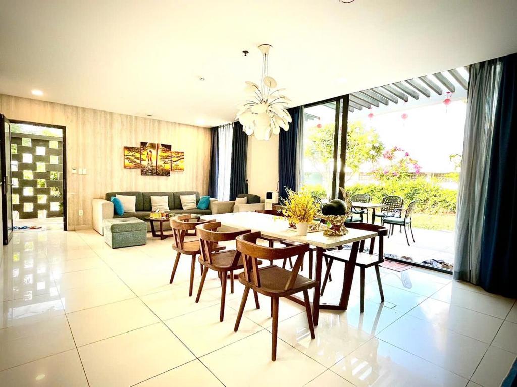 a living room with a table and chairs at 719 - Villa Oceanami - Phước Hải in Long Hai