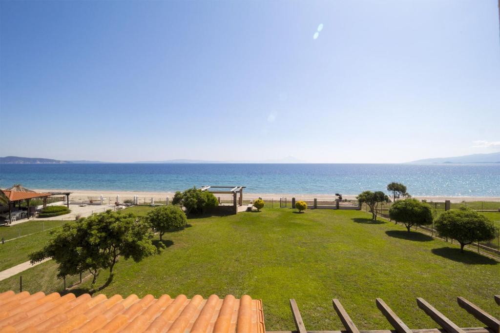 a large park with a view of the beach at Villa Nefeli - Akti Salonikiou A in Agios Nikolaos