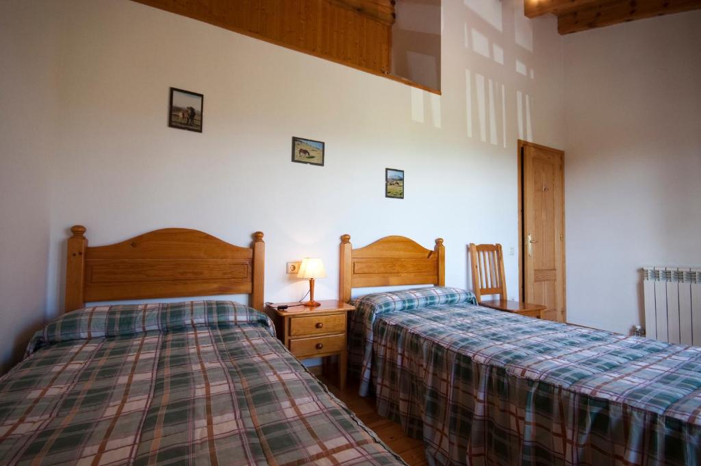 Postel nebo postele na pokoji v ubytování Mas Meya
