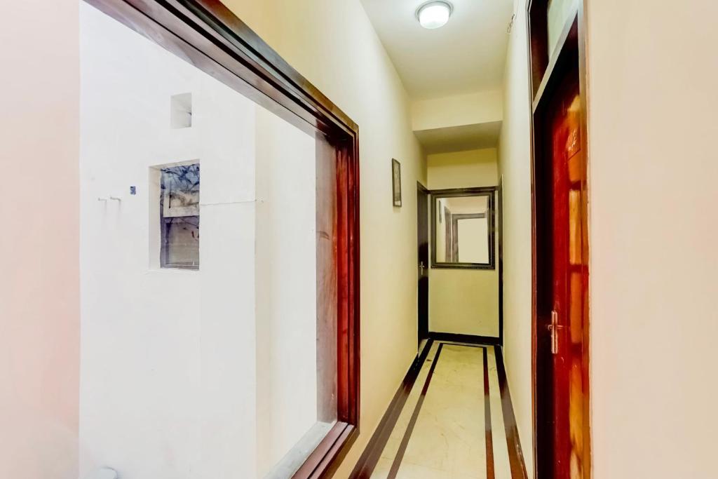 an empty hallway with a bowling alley at Hotel O Le Regent in Gurgaon
