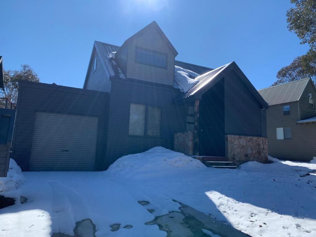 a house with snow in the yard at Keystone in Dinner Plain