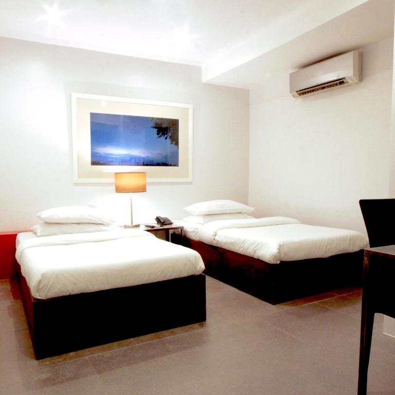 Postel nebo postele na pokoji v ubytování Hotel Durban