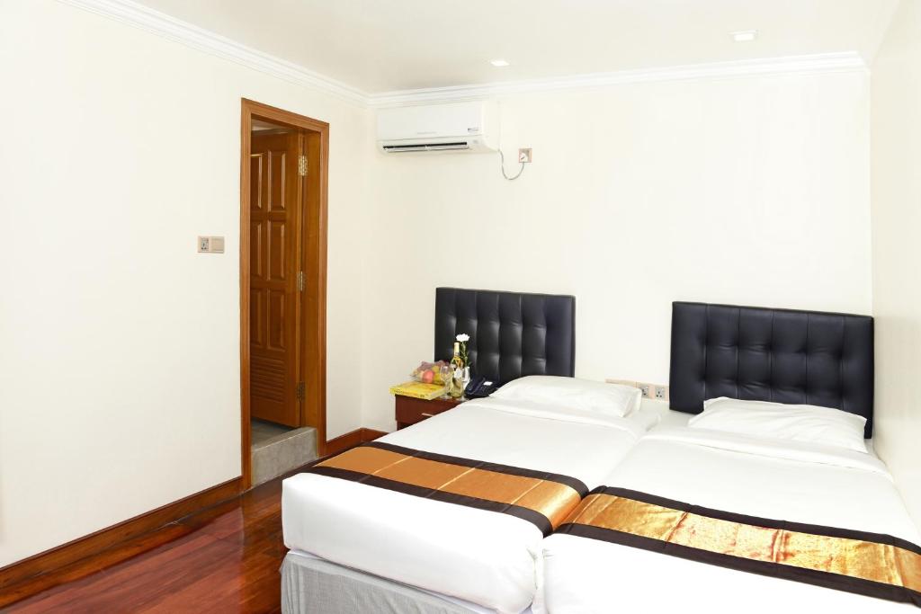 Postel nebo postele na pokoji v ubytování Hotel Bond