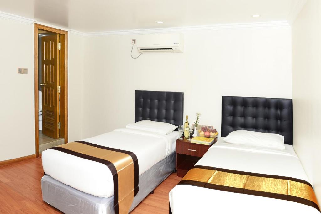 Postel nebo postele na pokoji v ubytování Hotel Bond