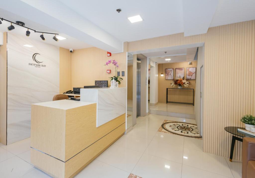 a lobby of a dental office with a reception counter at Skypark Bay Hotel in Manila