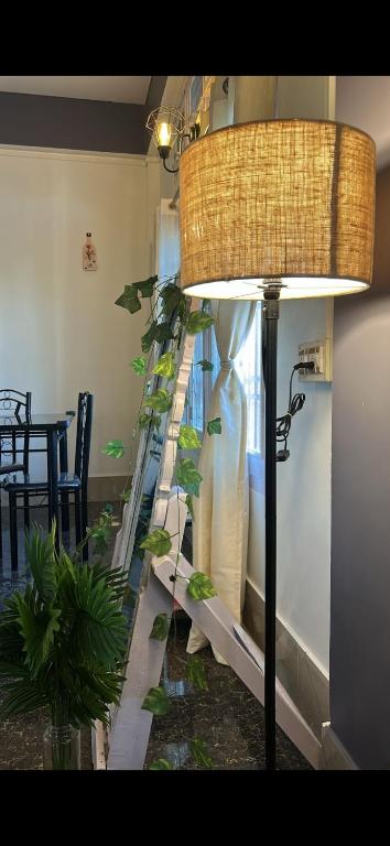 a room with a staircase with a plant at Pipitsnest 2 homes in Tezpur