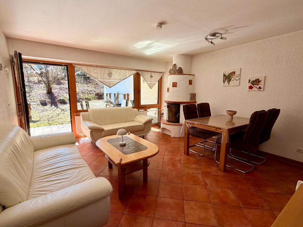 a living room with a couch and a table at Ferienwohnung Bergpanorama Schönau in Schönau am Königssee