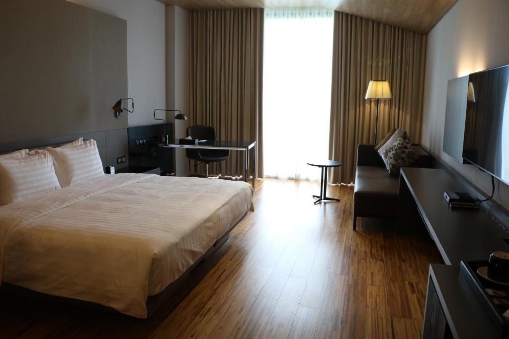 Postel nebo postele na pokoji v ubytování Midori Clark Hotel and Casino