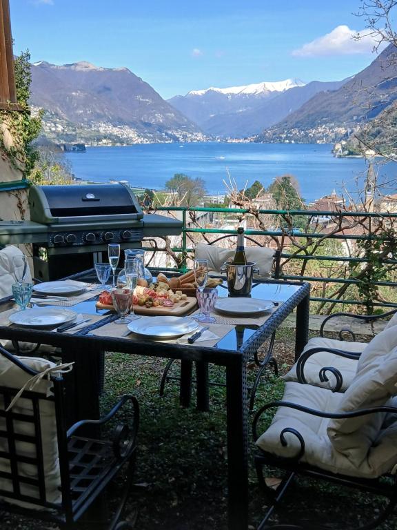 a table with a plate of food and a grill at como villa il panorama in Como
