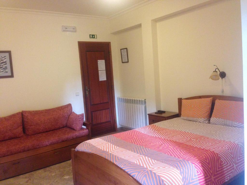 Uma cama ou camas num quarto em Quinta das Cegonhas