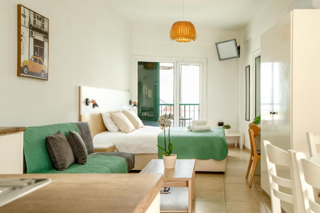 a living room with a couch and a bed at 4YOU STUDIOS in Larnaca