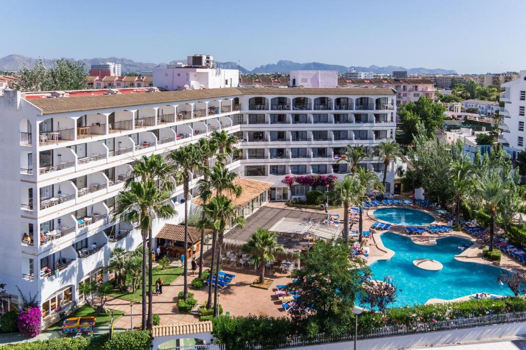 an aerial view of a hotel with a pool and resort at Sol de Alcudia Apartamentos in Port d'Alcudia