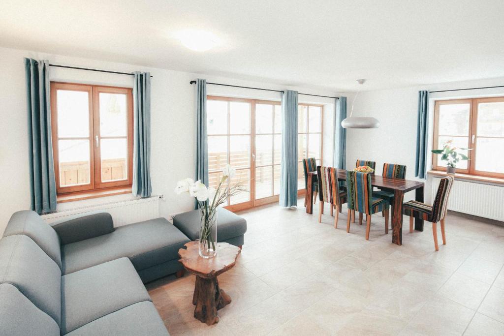a living room with a couch and a table at Luna Blanca - Apartment 2 in Schwangau