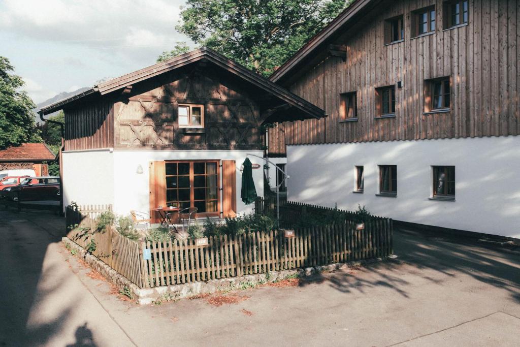 a large wooden house with a fence in front of it at Luna Mia 1 Chalet in Schwangau