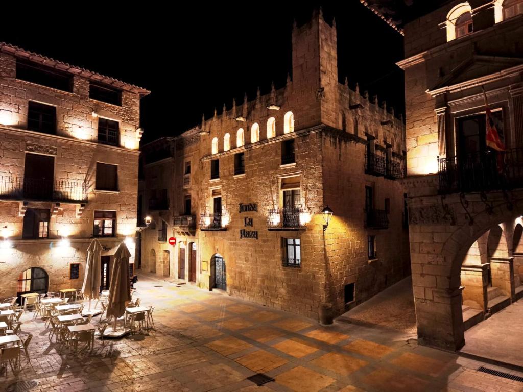 an empty courtyard in an old building at night at Fonda la Plaza in Valderrobres