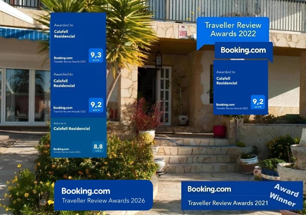 a blue sign in front of a house at Calafell Residencial in Calafell