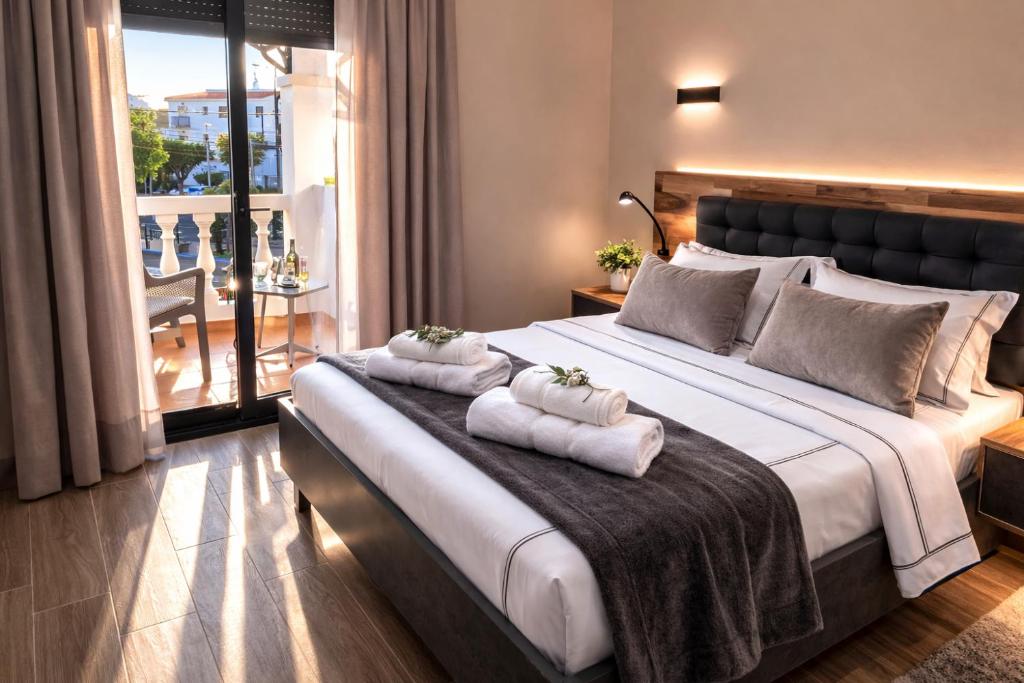 Llit o llits en una habitació de NerjaRooms