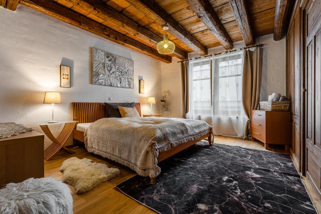a bedroom with a bed and a large window at Apartment Walhallastrasse in Arbon