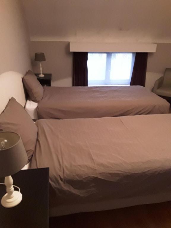 Postel nebo postele na pokoji v ubytování Wenceslas Cobergher III