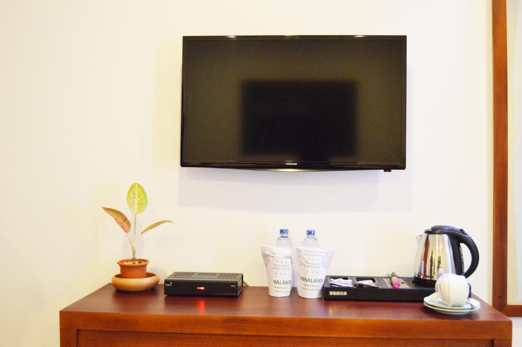 TV a/nebo společenská místnost v ubytování Cafe Pinnalanda
