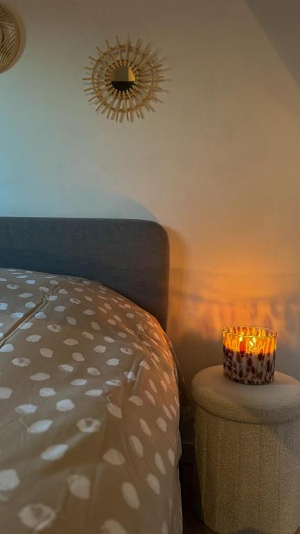a room with a bed and a table with candles at RR4 - Penthouse in Antwerp