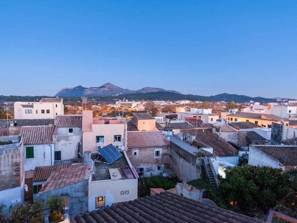 an aerial view of a city with roofs at Cas Ferrer Nou Hotelet in Alcudia