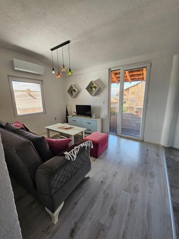 a living room with a couch and a table at Markos Towers Apartments in Prilep