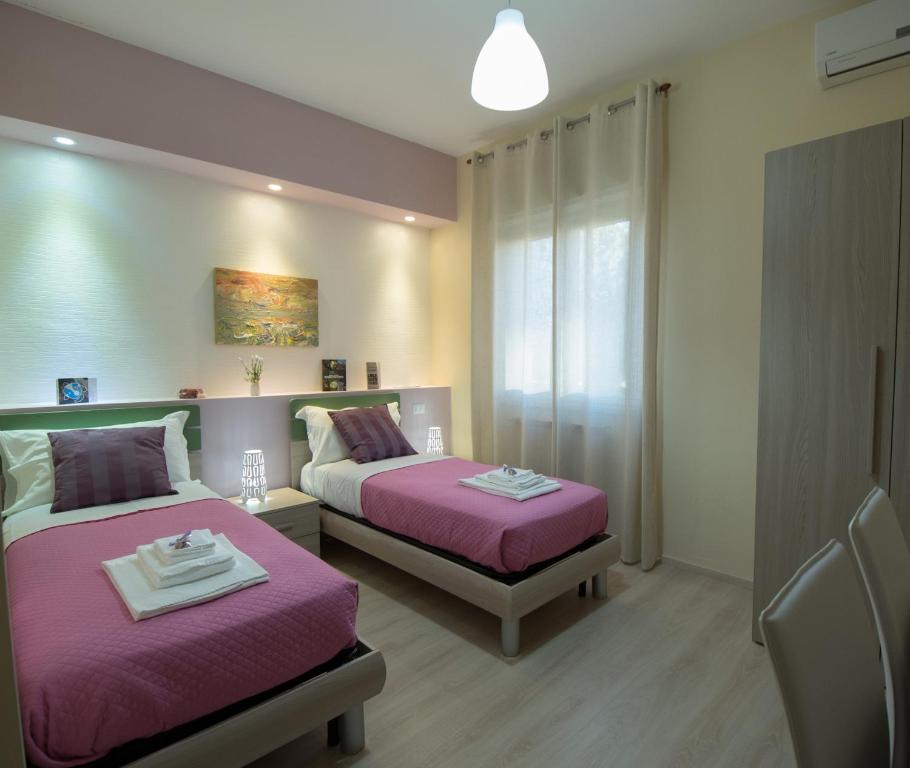 Postel nebo postele na pokoji v ubytování B&B Giunone