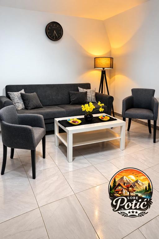 a living room with a couch and a coffee table at Sobe Potić in Belgrade