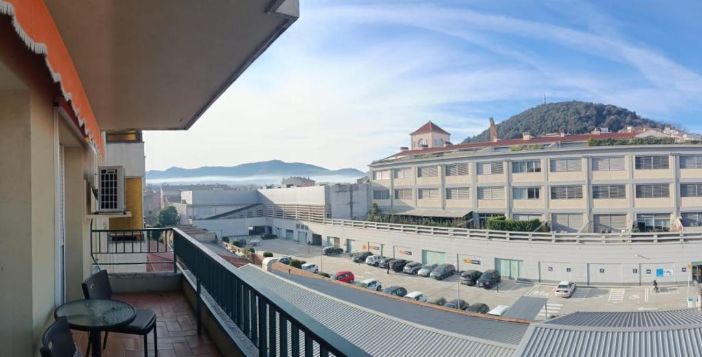 a balcony view of a large building with a parking lot at Olot céntrico, La Garrotxa, Petfriendly in Olot